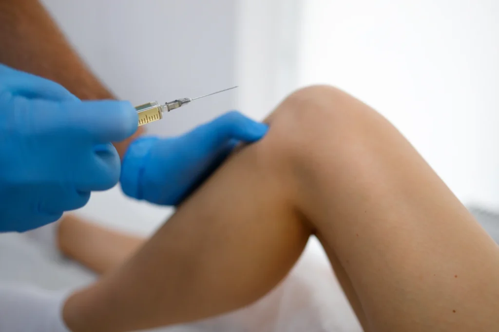 close up view pf doctor hands with syringe injects 2024 10 18 08 20 18 utc