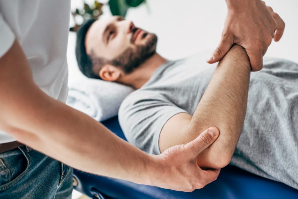 About Us 1 selective focus of chiropractor massaging arm of p 2024 11 17 21 46 51 utc